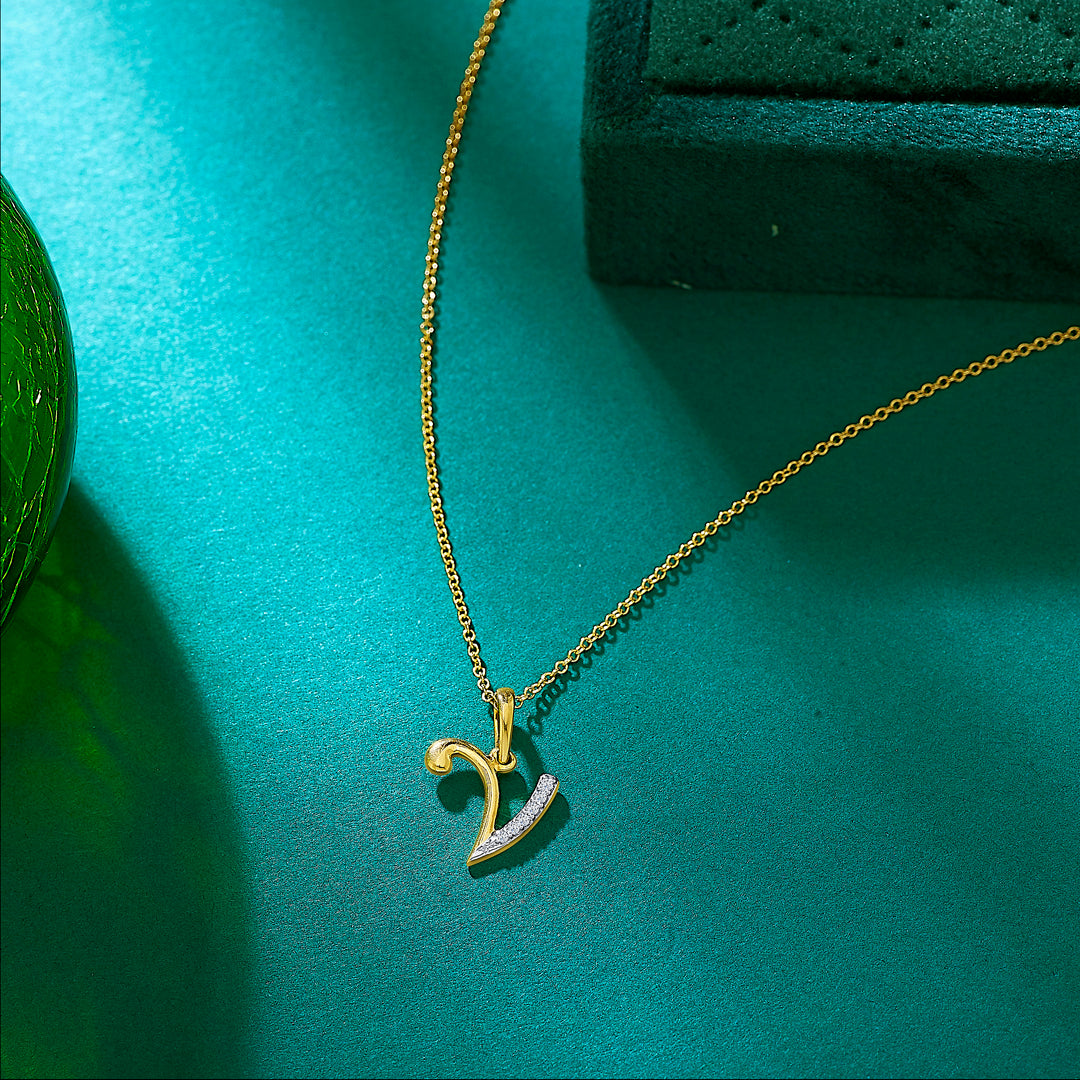 letter v yellow gold & diamond casual pendant