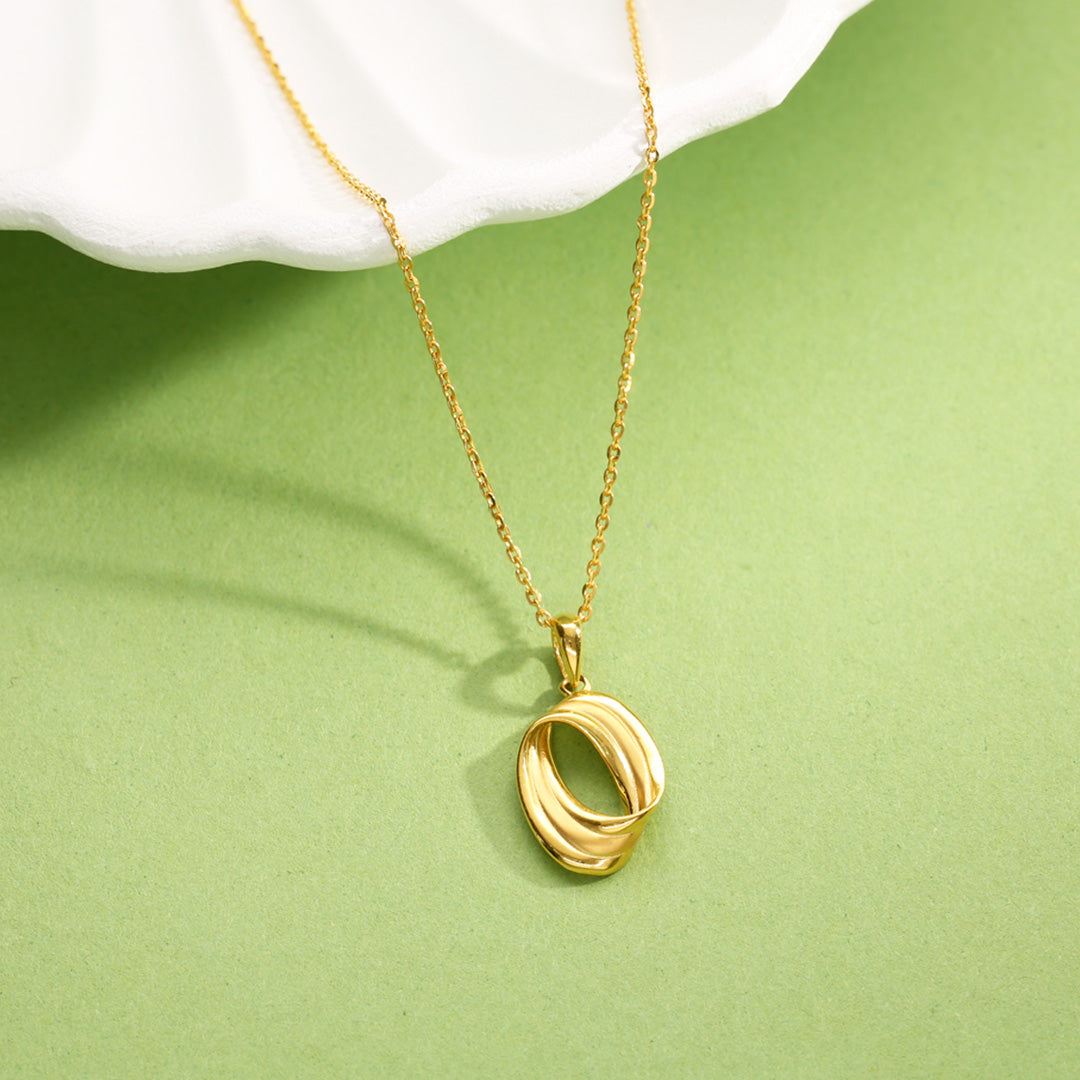 coiled vortex modern gold necklace