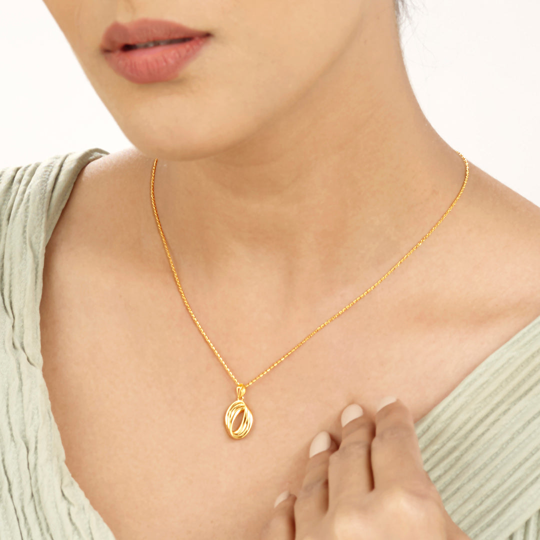 coiled vortex modern gold necklace