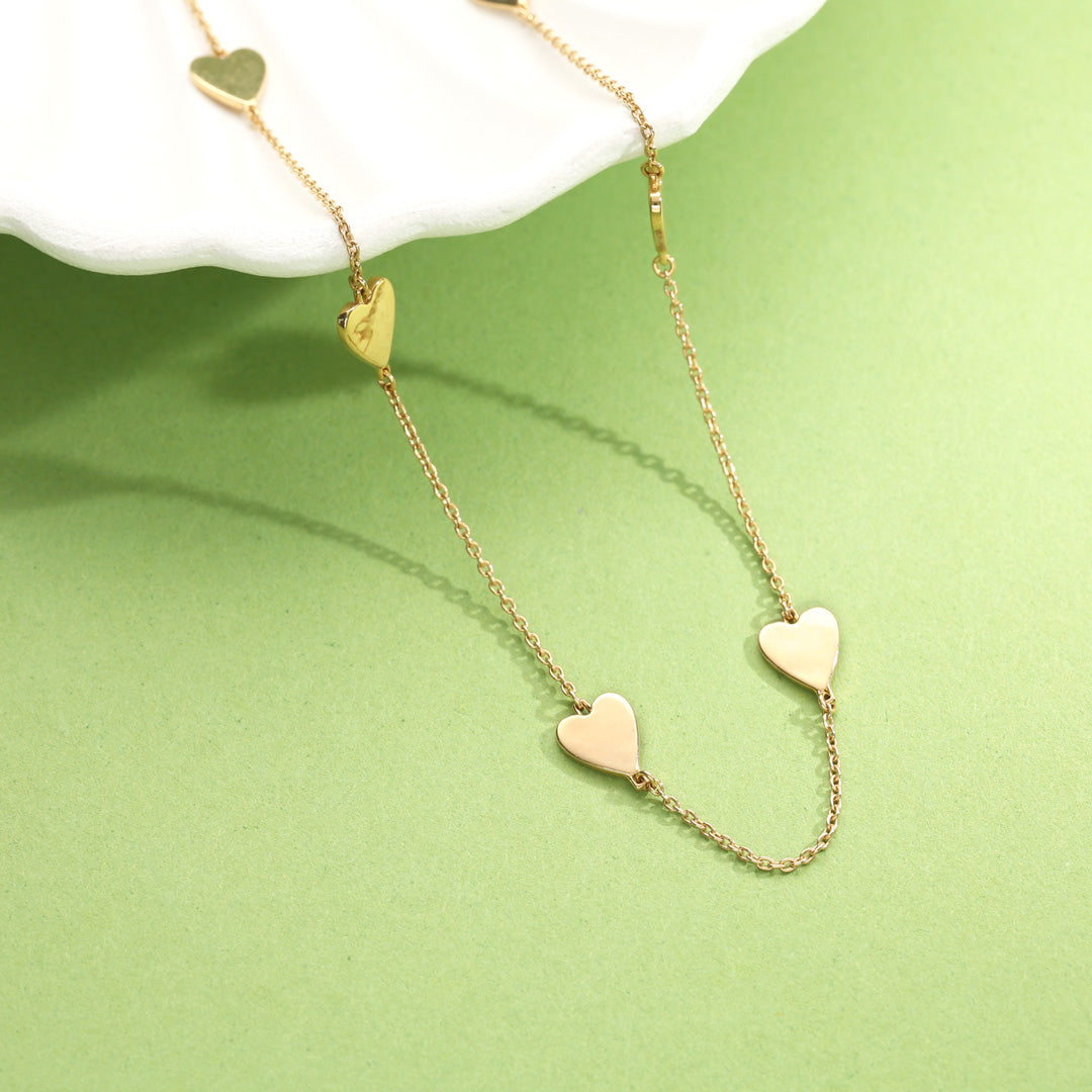 hearts in harmony modern gold necklace
