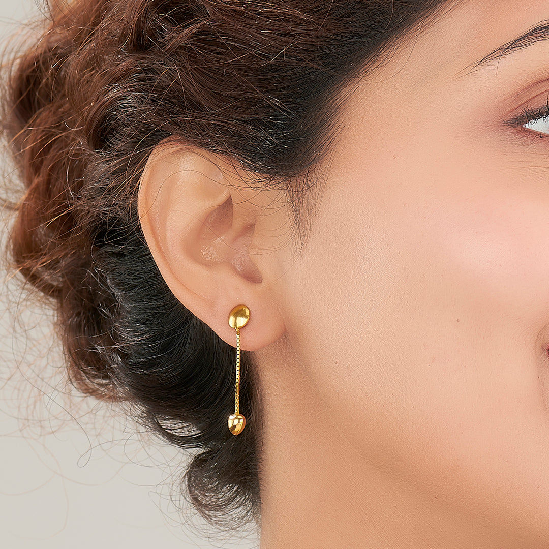 sleek pebble gold dangler earring for women