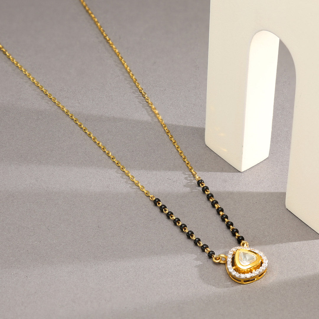 together woven gold mangalsutra for her